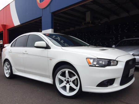 Mitsubishi Lancer Ralliart fitted with 18 inch Gloss White PDW Replay 